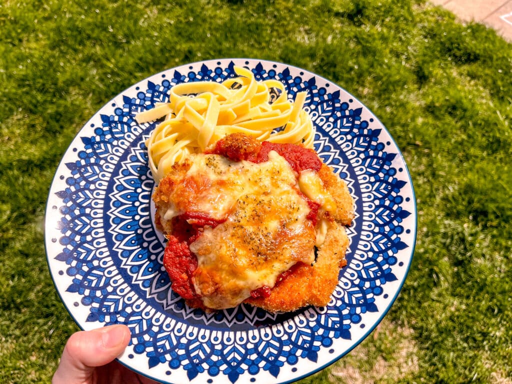 best chicken parm on a blue plate