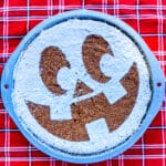 banana cake decorated as jack o lantern using icing sugar