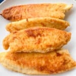Best Pan fried tilapia recipe on a white plate
