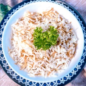 Mediterranean rice with angel hair pasta decorated with parsley