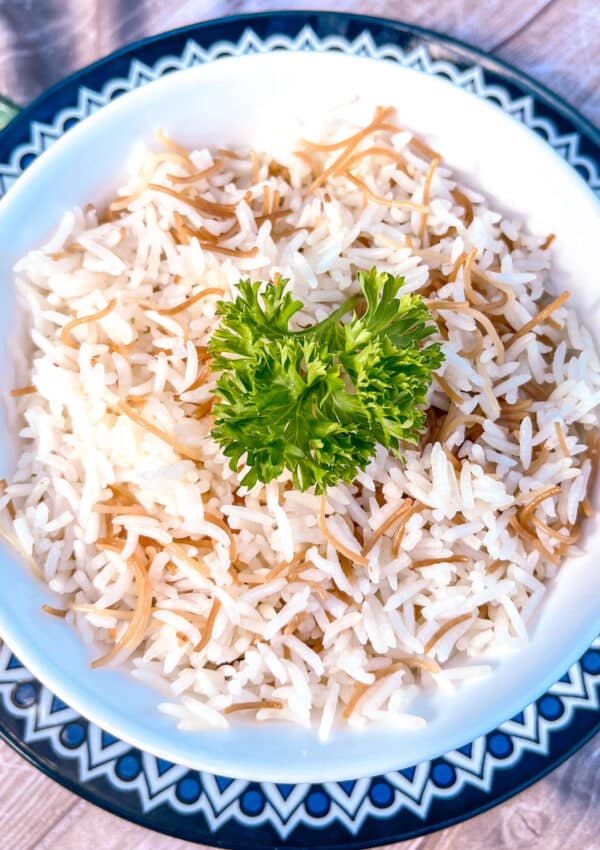 Mediterranean rice with angel hair pasta decorated with parsley