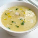 potato and leek soup in white bowl