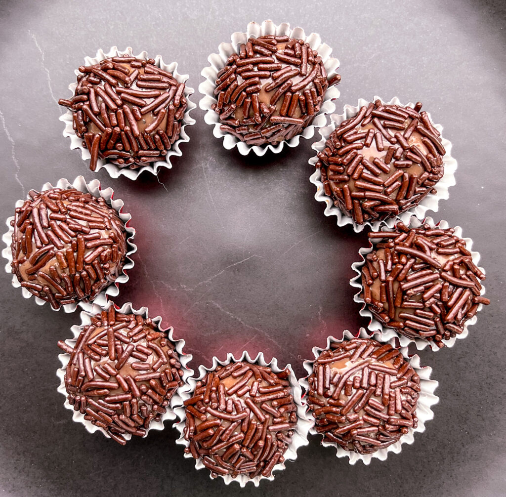 brigadeiros on a black plate