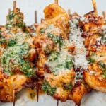 garlic chicken skewers on white plate made in an airfryer