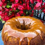 pumpkin cake with dulce de leche drizzle against red foliage