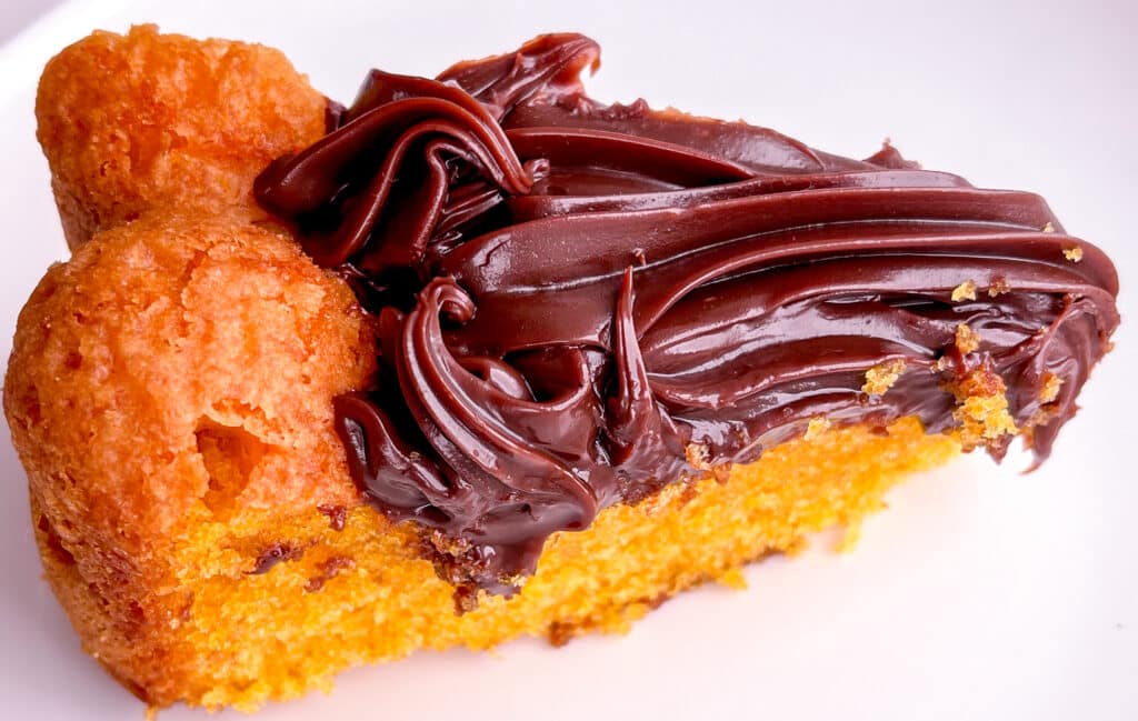 sliced brazilian carrot cake with brigadeiro frosting bolo de cenoura