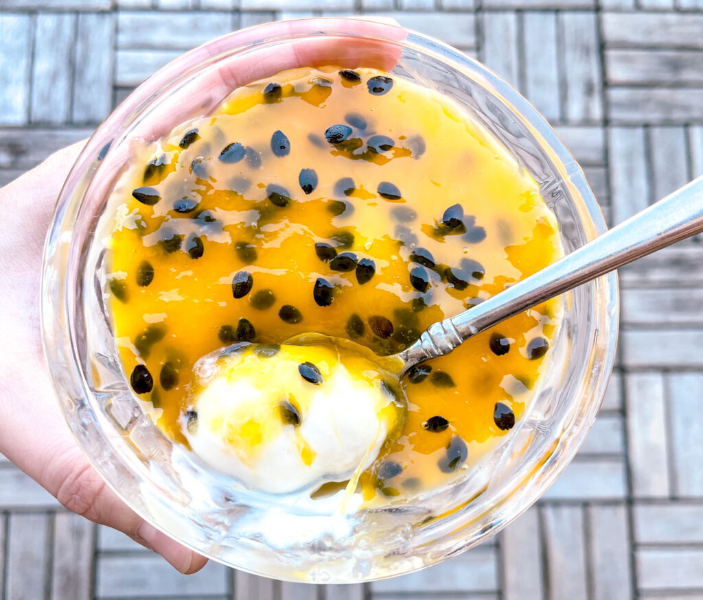 passion fruit mousse spoon inside cup