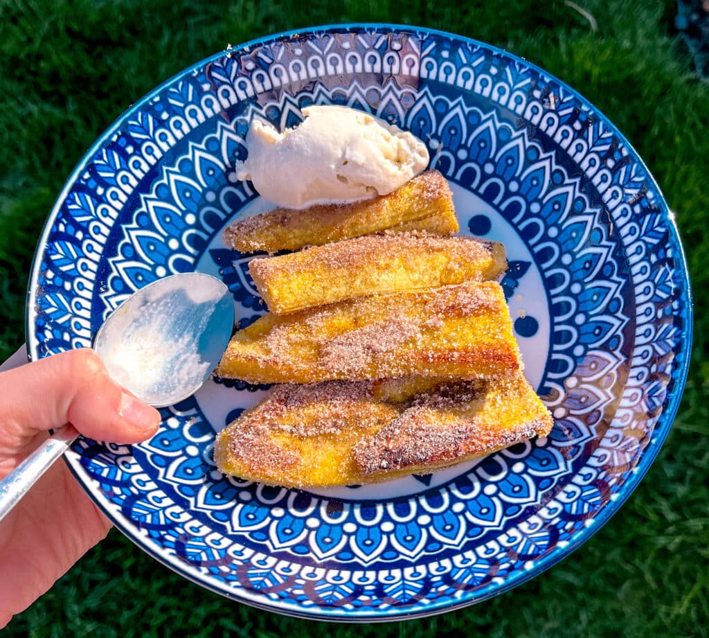 cinnamon sugar plantain on a colorful blue and white plate