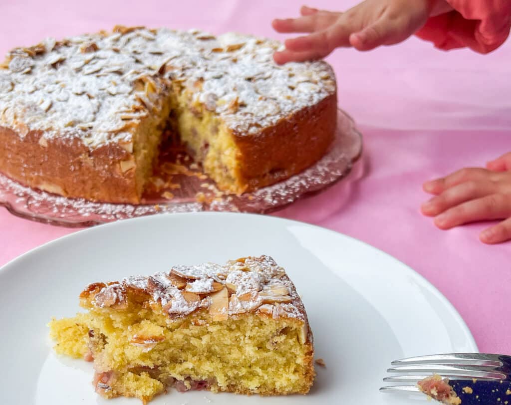 strawberry almond cake with little baby hands