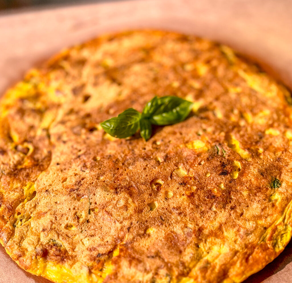 potato omelette with basil on top