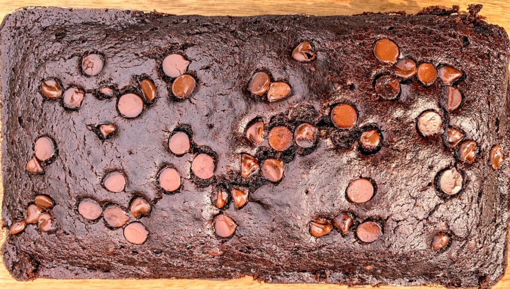 quick and easy blender chocolate zucchini bread on wooden slat