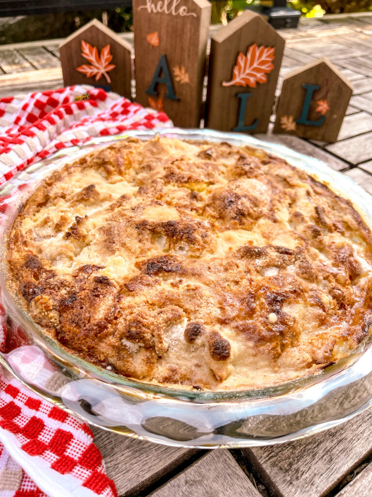 Lazy apple pie with fall background and a bee flying above it