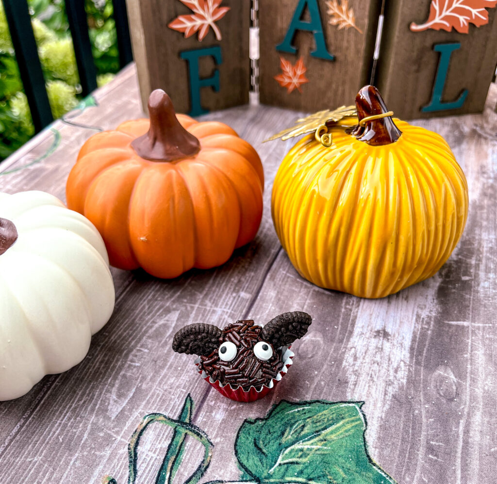 bat brigadeiros with pumpkins in the background