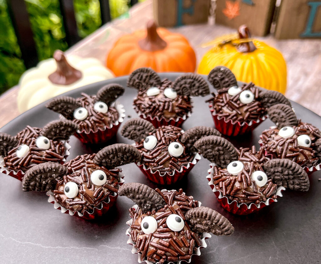bat brigadeiros with pumpkins in the background