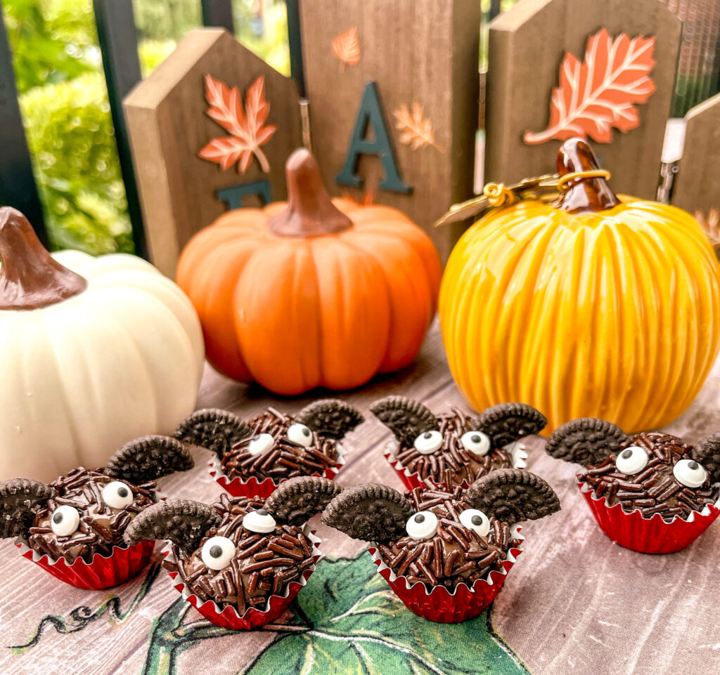 bat brigadeiros with pumpkins in the background