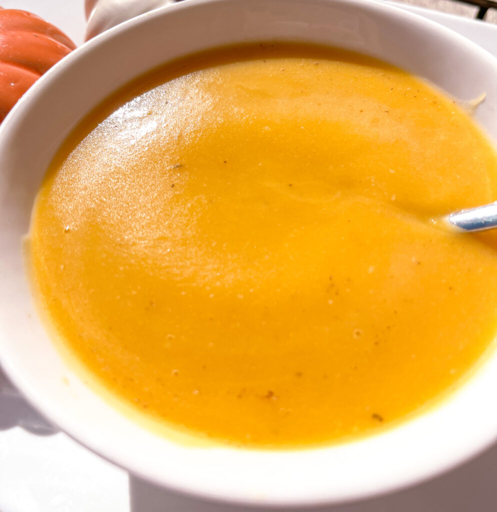 up close shot of Easy Butternut Squash soup in a white bowl