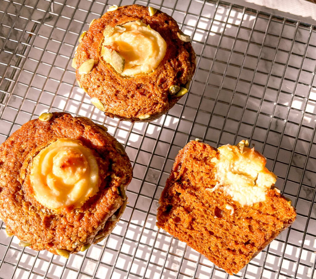 pumpkin muffin with cream cheese filling close up sliced