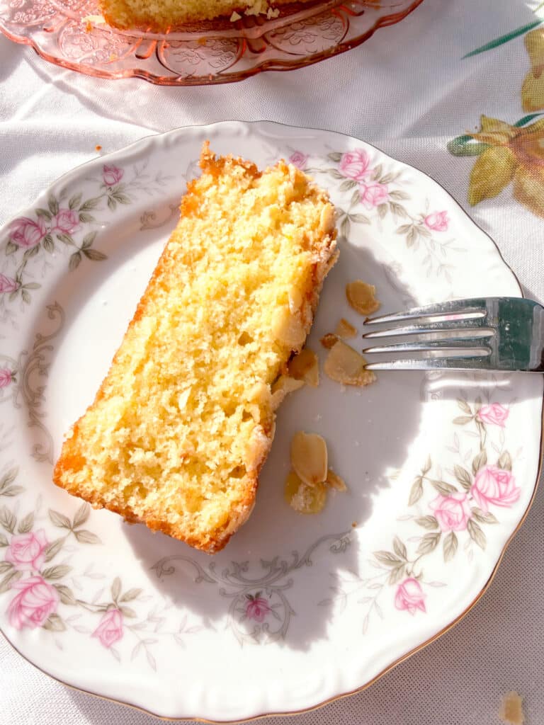 one bowl orange yogurt cake with crunchy almond topping slice