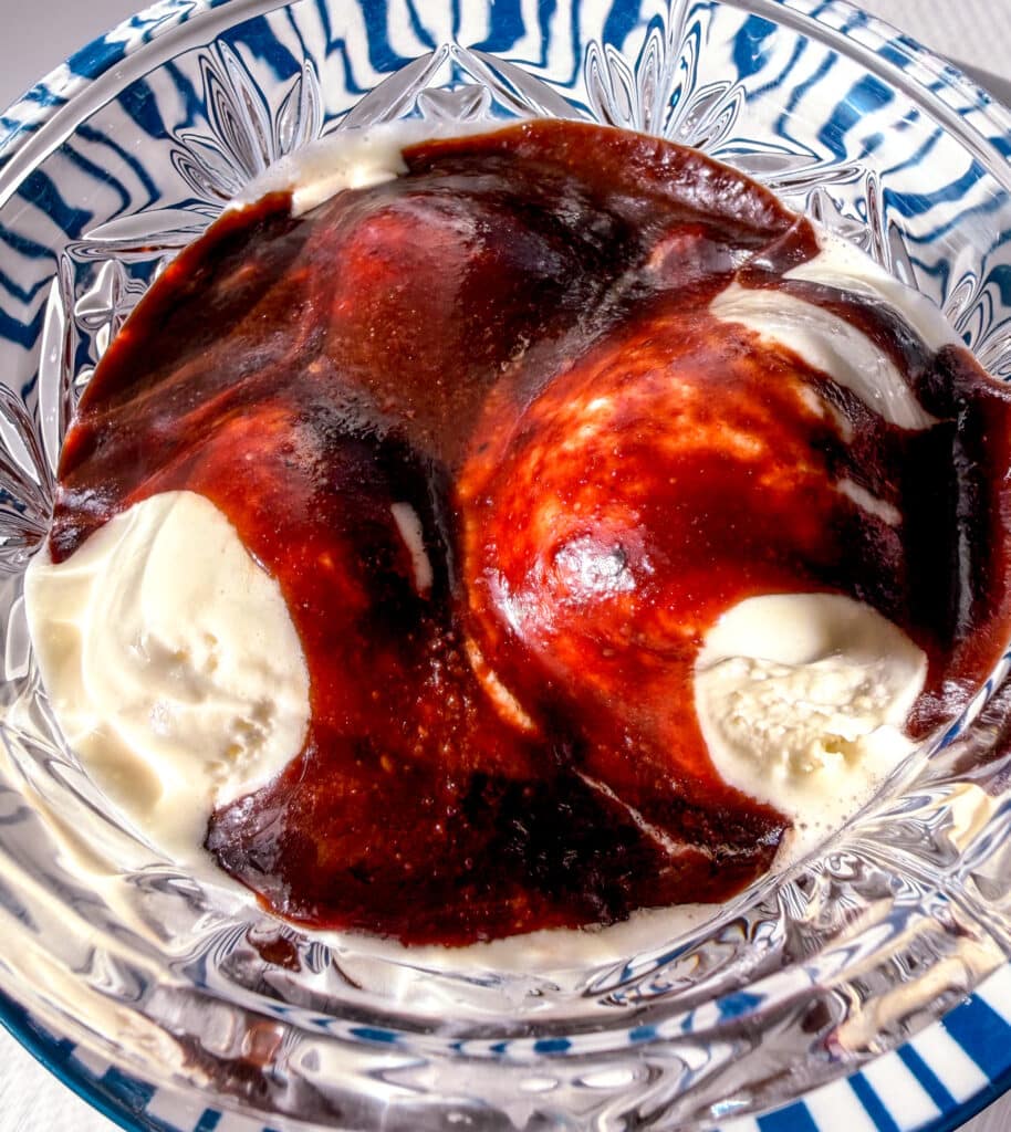chocolate syrup on vanilla ice cream