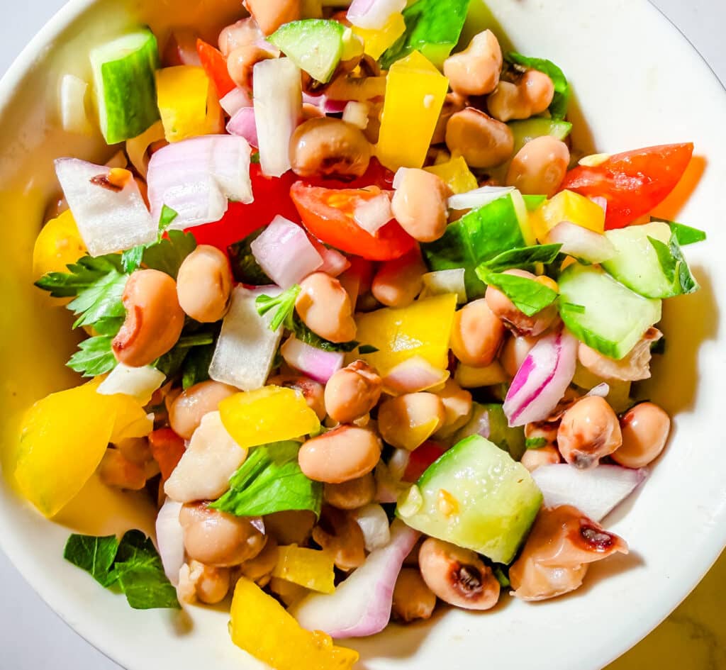 close up of black eyed pea salad with honey mustard dressing