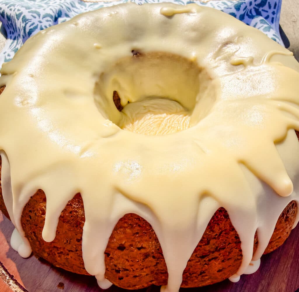 bundt cake covered wiht porcelain/orange milk glaze before adding the decor. 