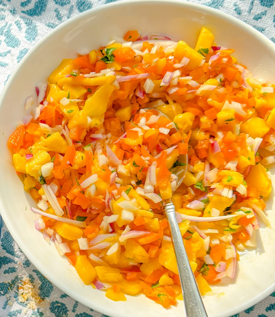 Fresh mango salsa in a bowl with diced mango, red onion, pepper