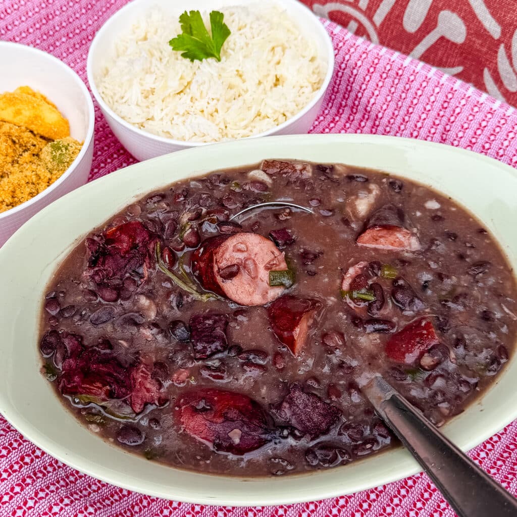feijoada served along side rice and farofa