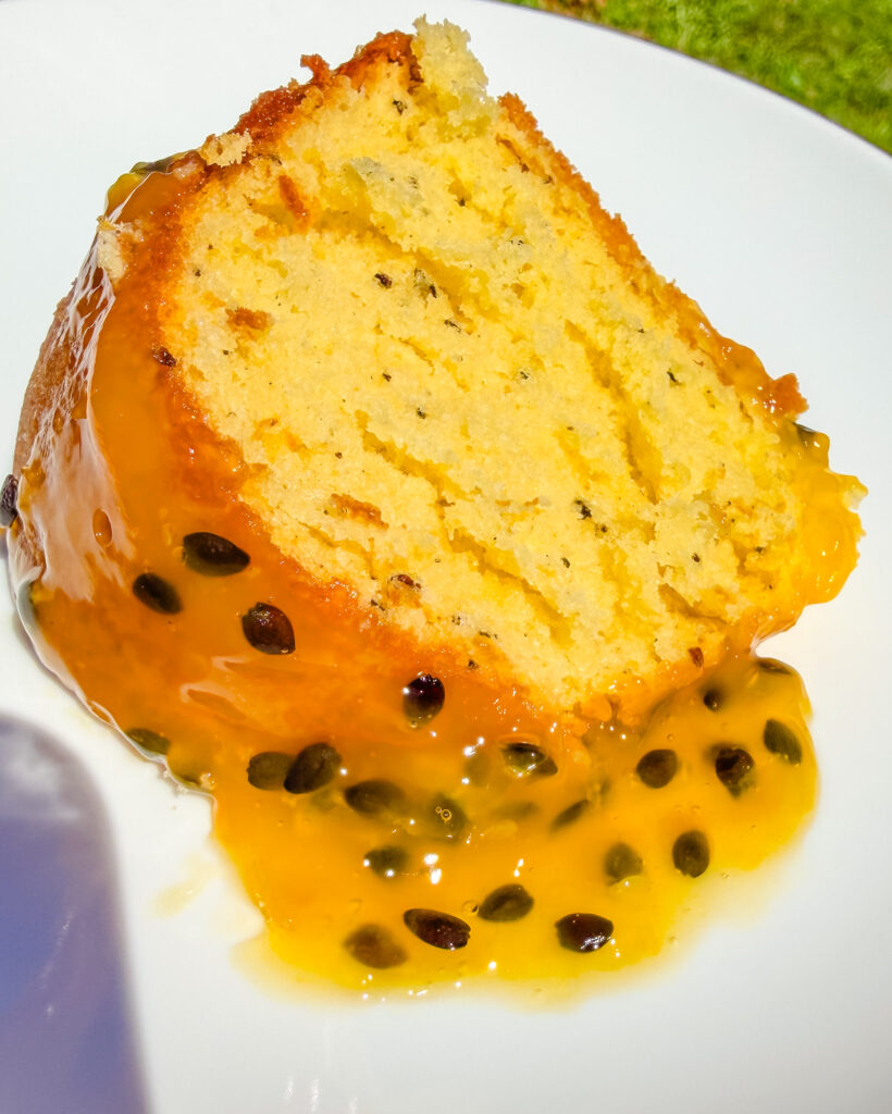 a slice of passion fruit bundt cake