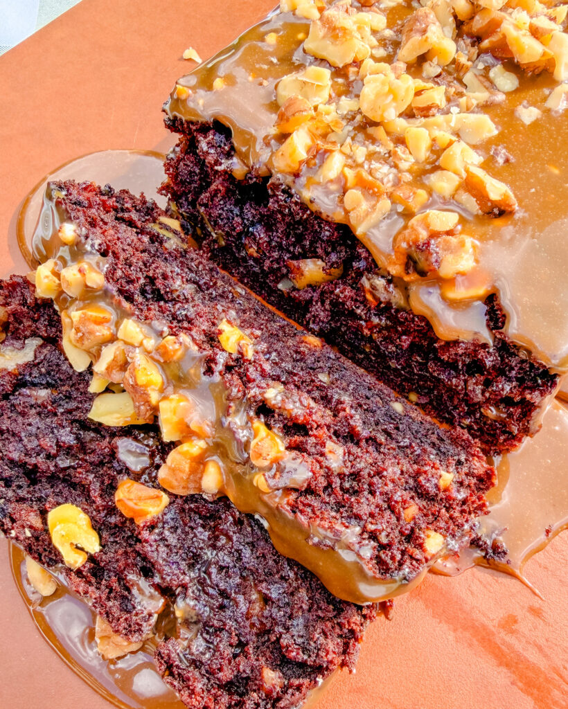slices of chocolate banana bread with walnuts and ice cream