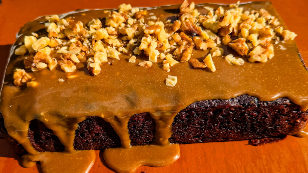 banana bread with walnuts and dripping coffee glaze