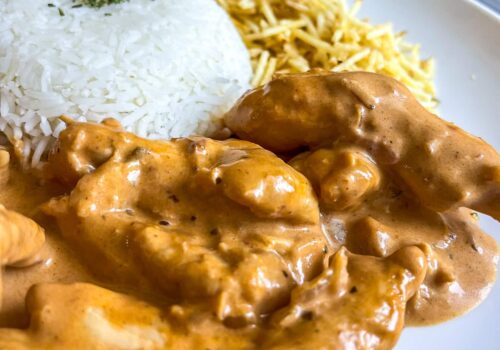 chicken stroganof served with white rice an potatoes