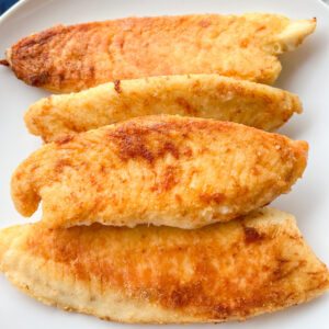 Best Pan fried tilapia recipe on a white plate